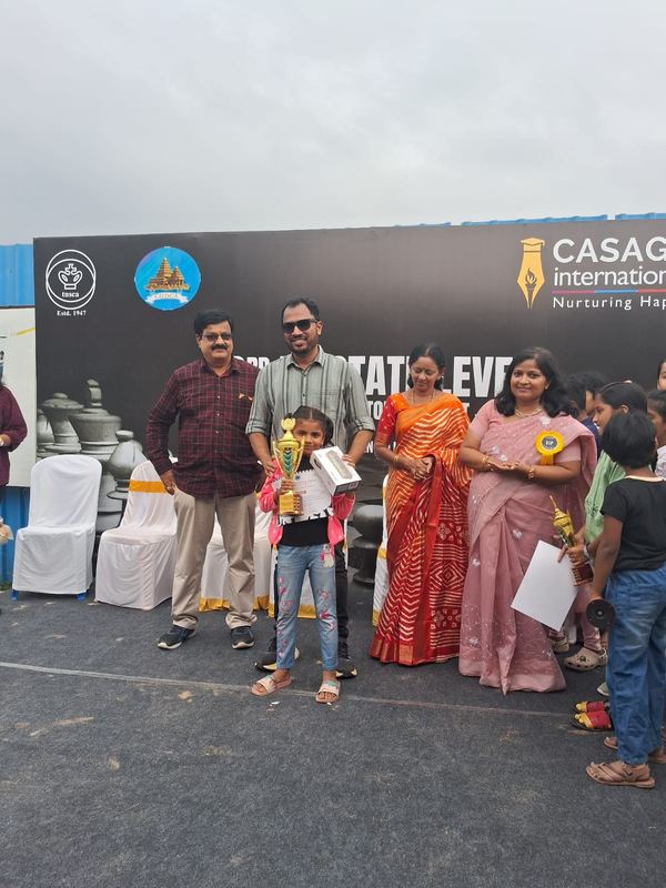 Meha receiving 1st prize at TNSCA State Level Chess Tournament at CASAG International School